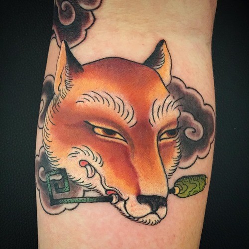 Old school colored funny fox tattoo on leg with mystical key