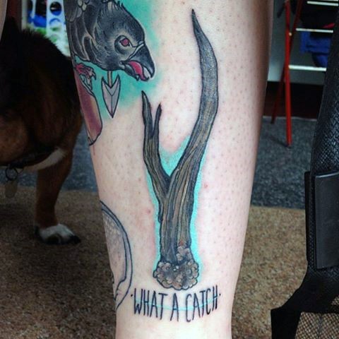 Old school colored leg tattoo of deer horn and lettering