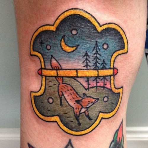 Old school colored little hinge tattoo stylized with fox in forest