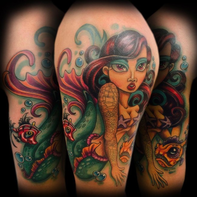 Old school colored mermaid tattoo on shoulder with cute fishes