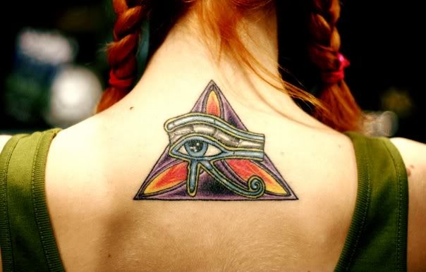 Old school colored mystic pyramid tattoo on upper back stylized with the Eye of Horus