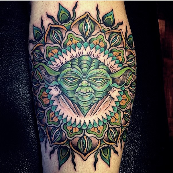 Old school colored mystical designed Yoda tattoo on leg stylized with eyes