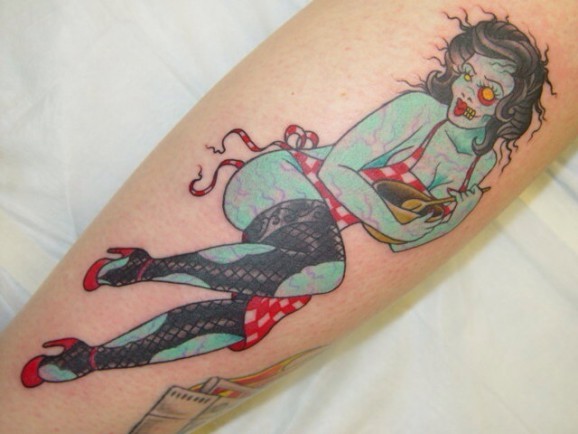 Old school colored seductive zombie girl tattoo on arm