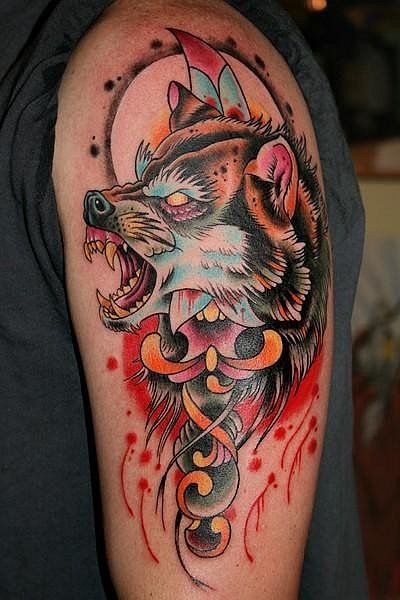 Old school colored shoulder tattoo of demonic wolf head with sword