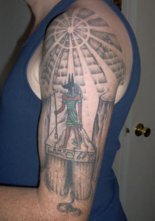 Old school colored shoulder tattoo of Anubis god and antic temple