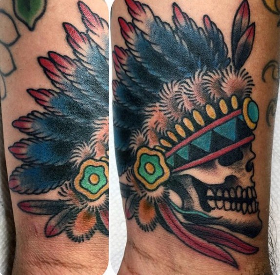 Old school colored tiny Indian skull with helmet tattoo