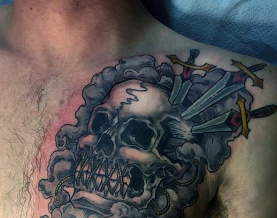 Old school colored tortured skull with swords tattoo on chest