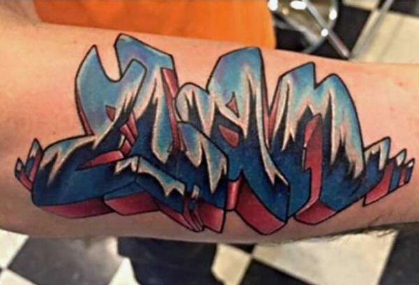 Old school graffiti style colored arm tattoo of lettering