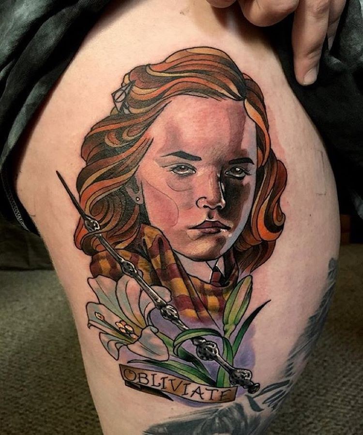 Old school like cute colored Hermione portrait tattoo on thigh with magic stick and lettering