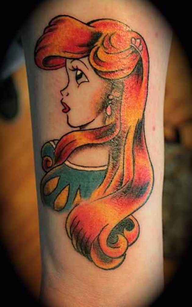 Old school looking colored arm tattoo of Ariel mermaid