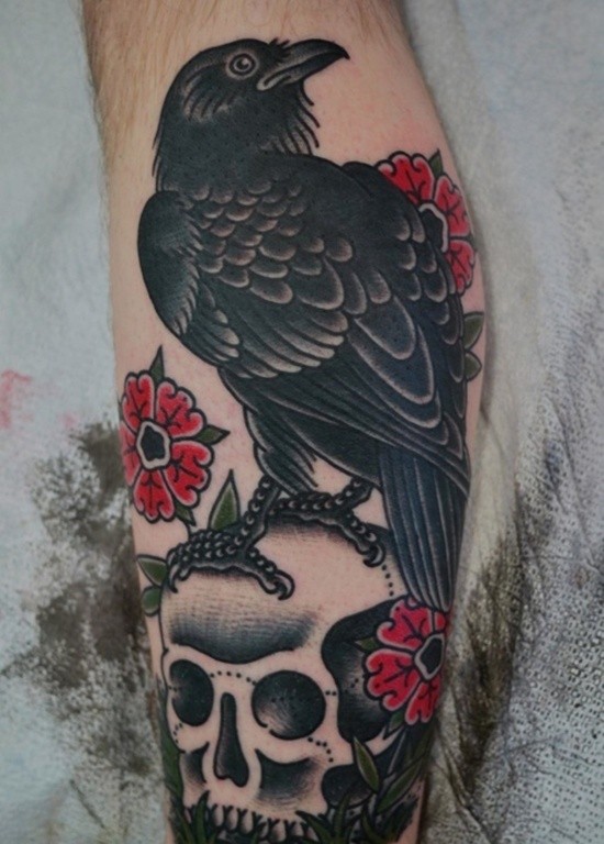 Old school multicolored arm leg tattoo of crow with flowers
