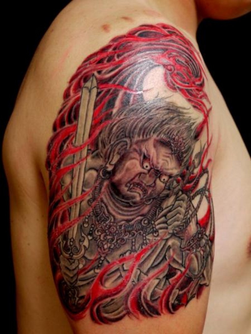 Old school multicolored demonic Asian man tattoo with flames