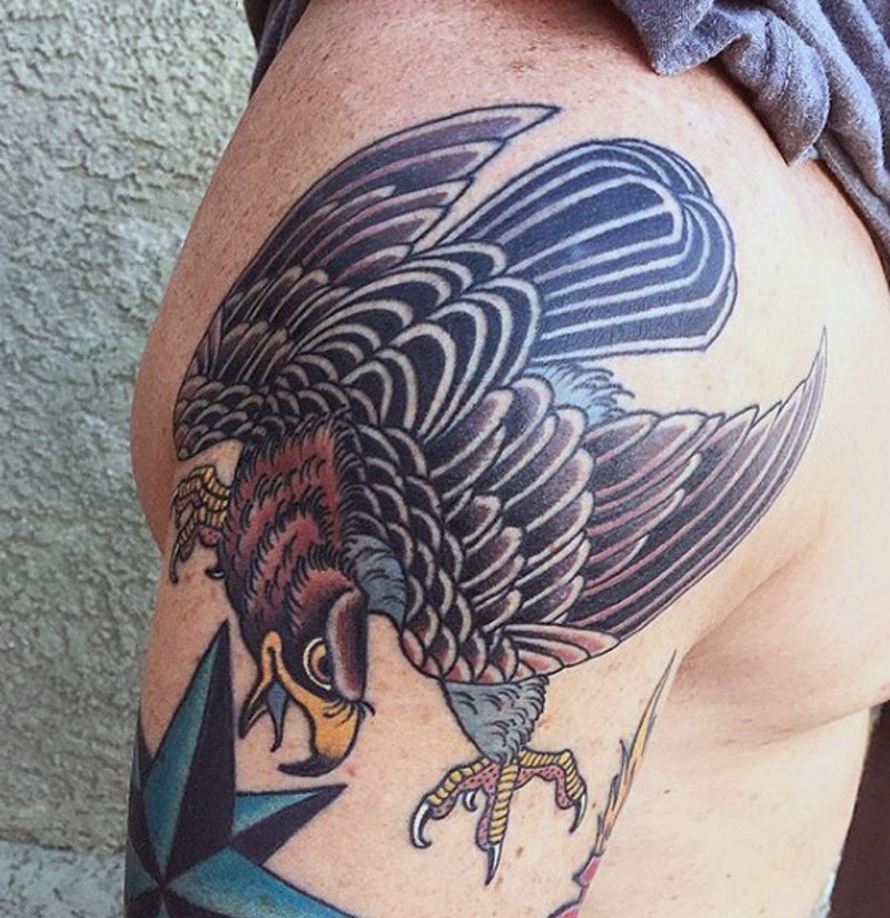 Old school multicolored shoulder tattoo of funny eagle