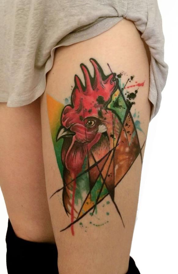 Old school multicolored thigh tattoo of cock head