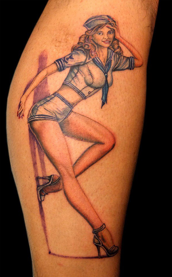 Old school painted colored pin up girl tattoo on leg