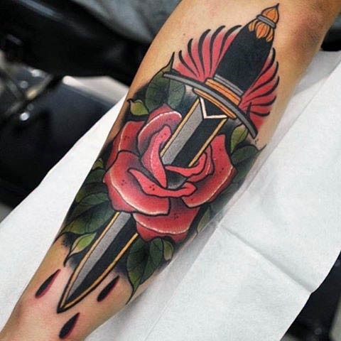 Old school simple designed forearm tattoo of red rose with dagger ...