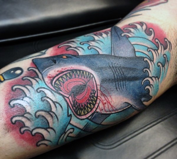 Old school style big evil looking shark tattoo on forearm
