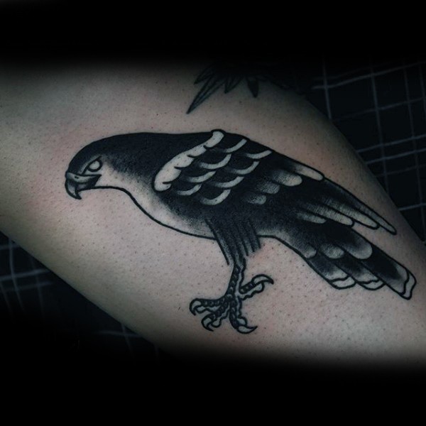 Old school style black and white little eagle tattoo on leg