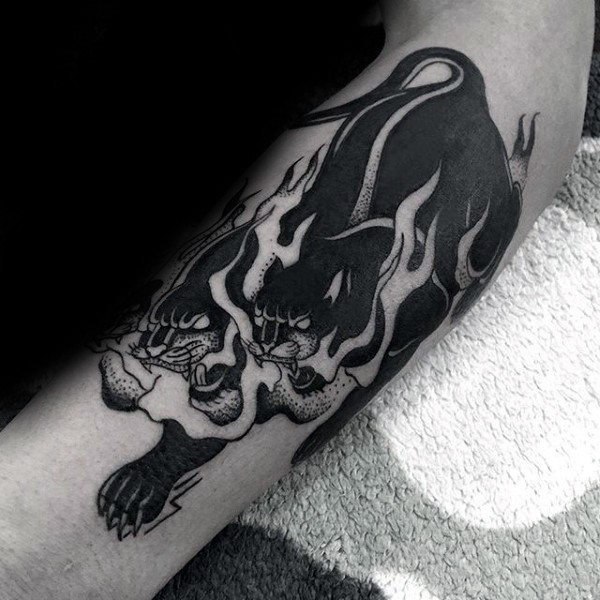 Old school style black ink arm tattoo of Cerberus with flames