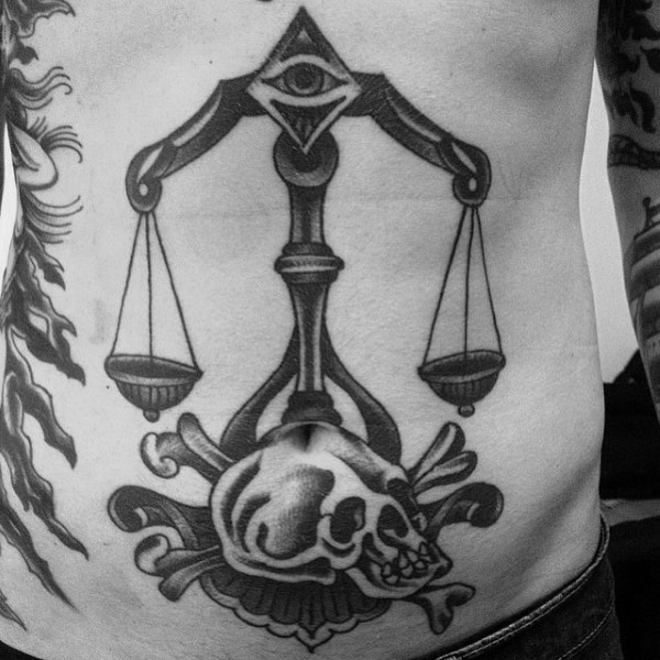 Old school style black ink belly tattoo of libra with skull