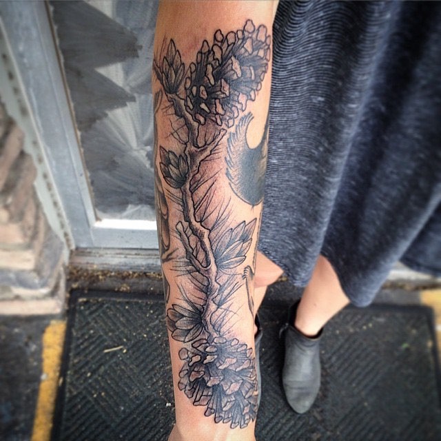 Old school style black ink fir-cones tattoo on forearm