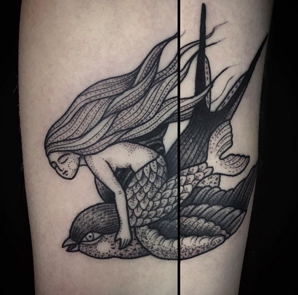 Old school style black ink forearm tattoo of mermaid flying the bird
