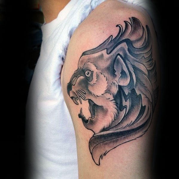 Tatuagem de ombro de tinta preta estilo old school da estátua do leão