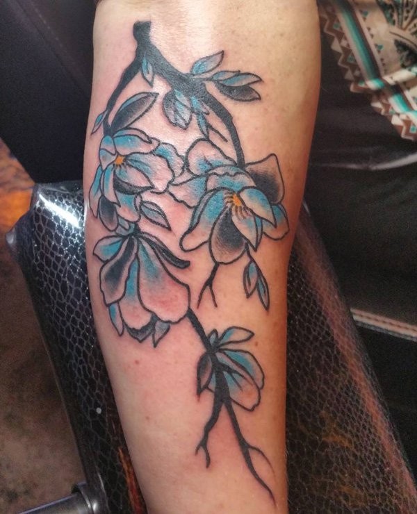 Old school style colored arm tattoo of nice flower