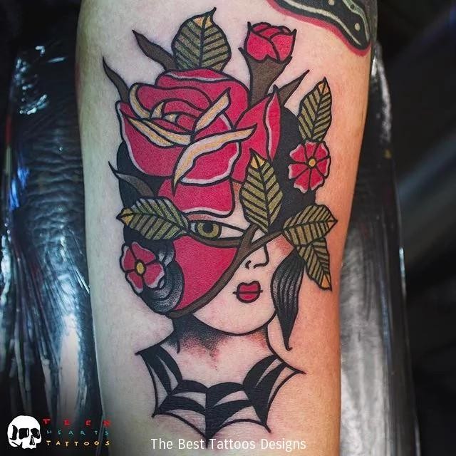 Old school style colored arm tattoo of woman face with roses