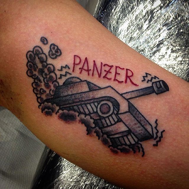 Old school style colored arm tattoo of small tank with lettering