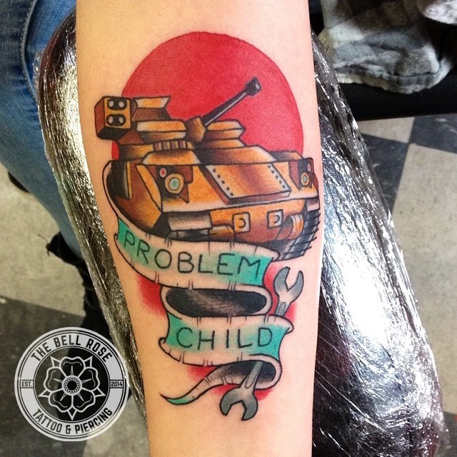 Old school style colored arm tattoo of modern tank with lettering