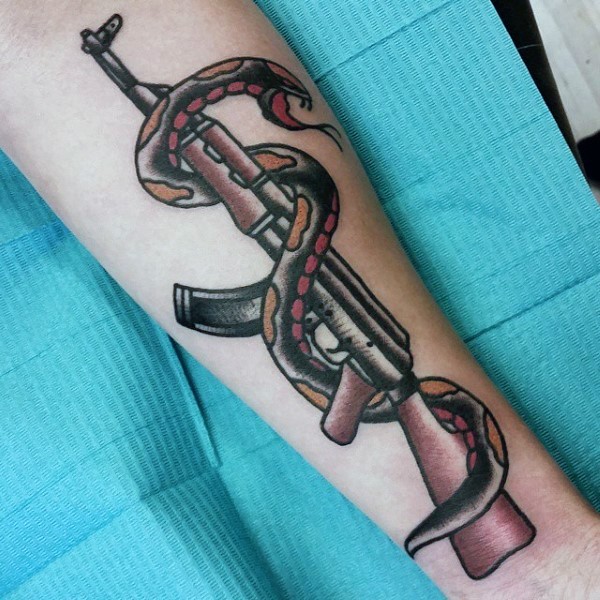 Old school style colored arm tattoo of AK rifle and snake