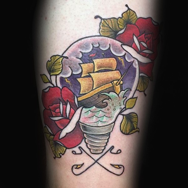 Old school style colored bulb with ship and flowers