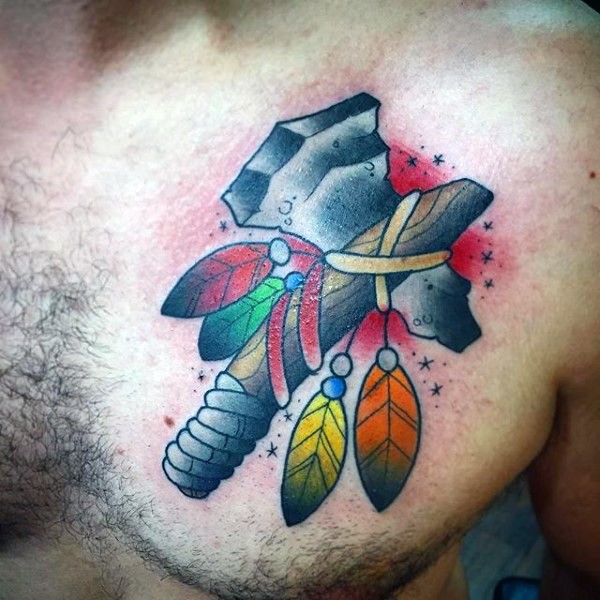 Old school style colored chest tattoo of Indian axe with feather