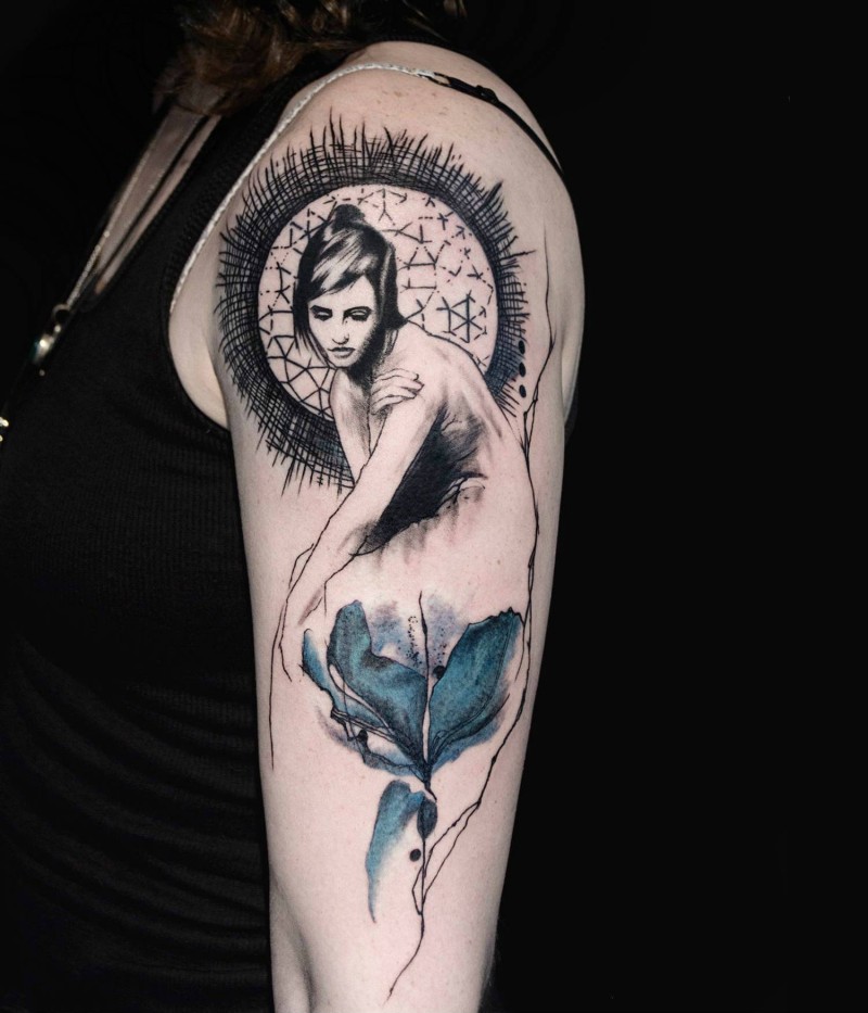 Old school style colored flower tattoo on shoulder combined with woman portrait