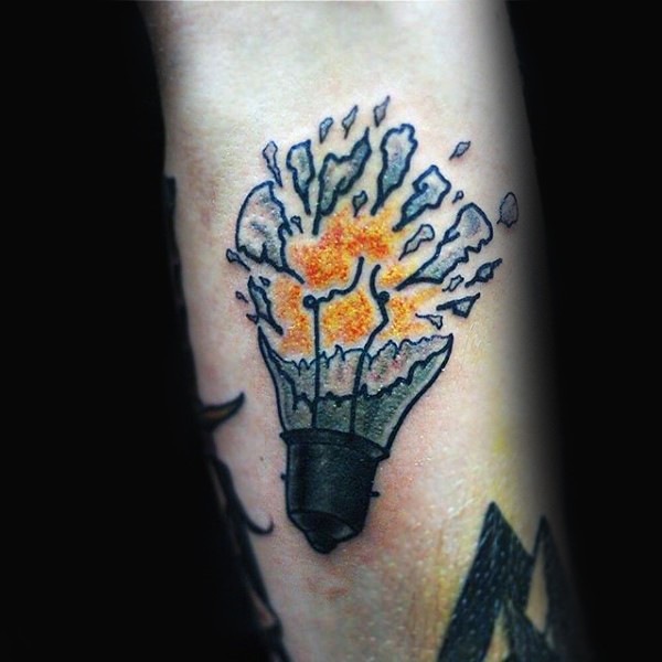Old school style colored forearm tattoo of small broken bulb