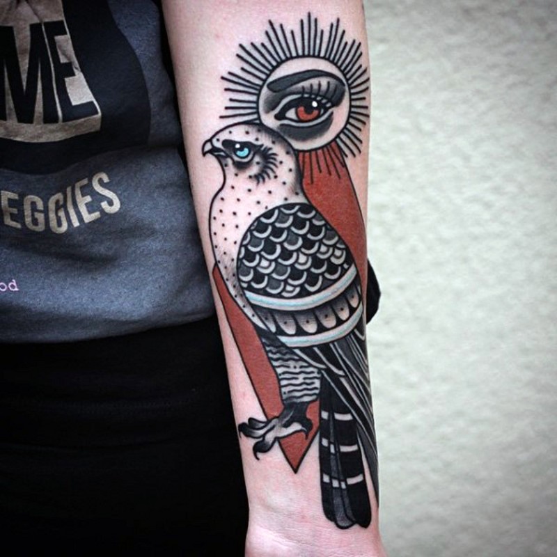 Old school style colored forearm tattoo of eagle and eye