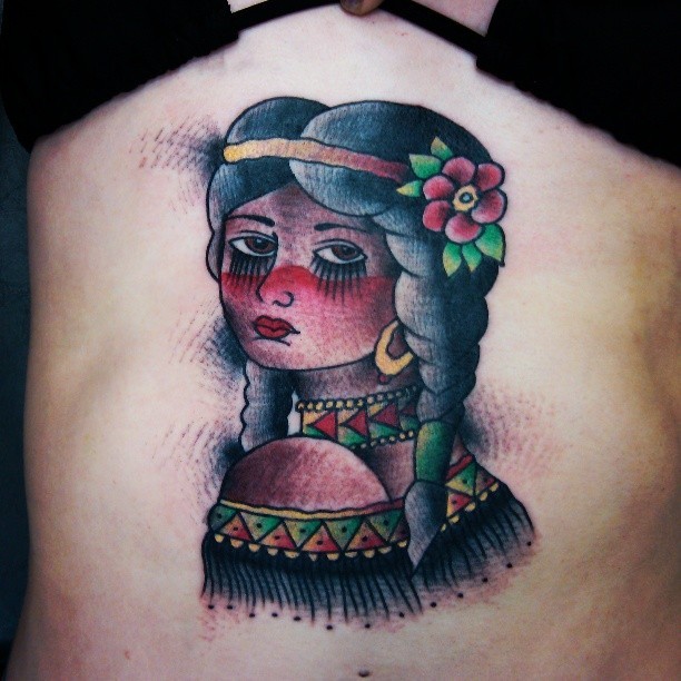 Old school style colored Indian woman tattoo with small flower