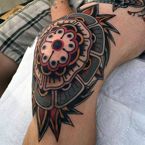 Old school style colored knee tattoo of big flower