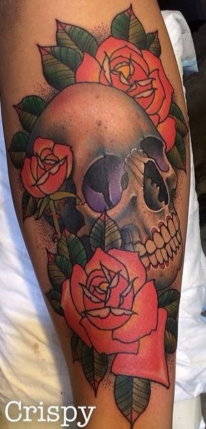 Old school style colored large leg tattoo of human skull with roses