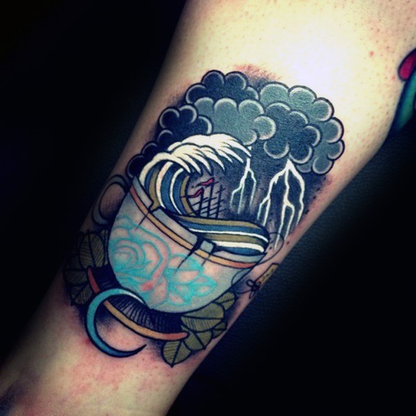 Old school style colored leg tattoo of cup with waves