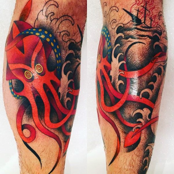 Old school style colored leg tattoo of red octopus with sailing ship