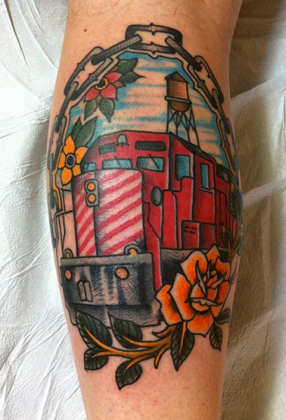 Old school style colored leg tattoo of modern train and roses