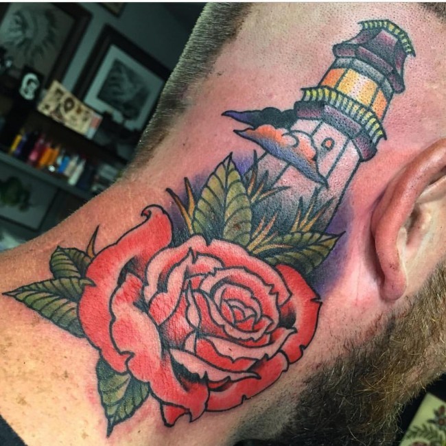 Old school style colored lighthouse tattoo on neck combined with rose flower