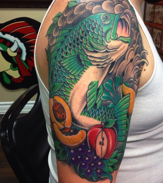 Old school style colored massive fish with fruits half sleeve tattoo