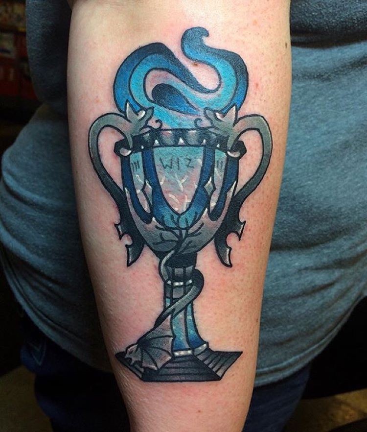 Old school style colored on forearm tattoo of big cup