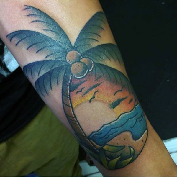 Old school style colored palm tree with sunset tattoo on arm