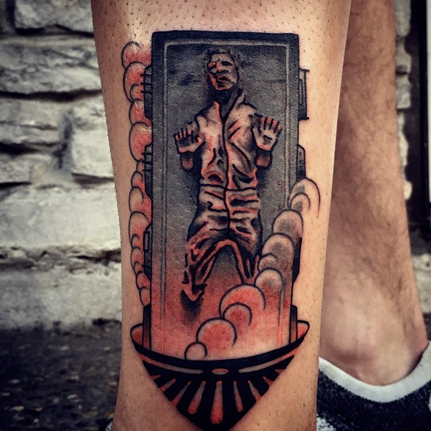 Old school style colored sealed Han Solo tattoo on lower leg