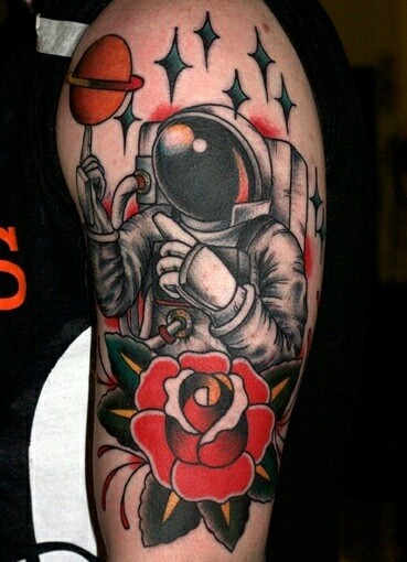 Old school style colored shoulder tattoo of astronaut with flower