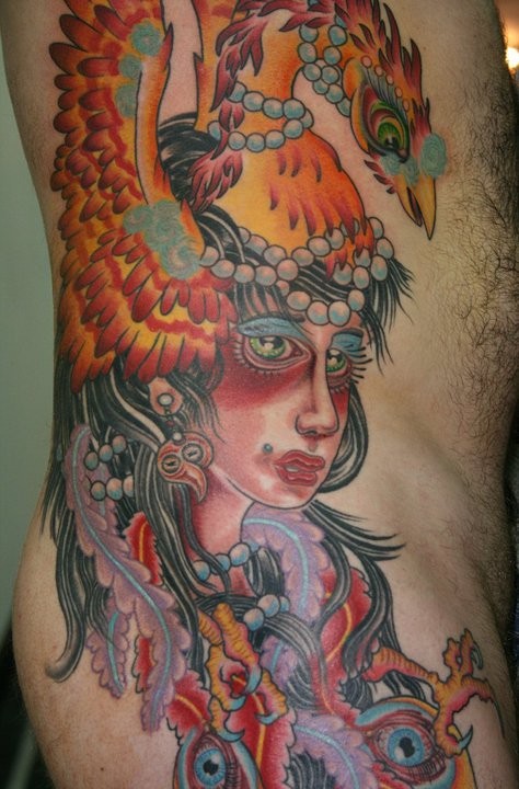 Old school style colored side tattoo of woman with phoenix bird